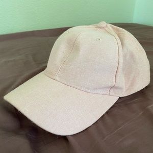 Millennial pink hat with faux leather snap closure
